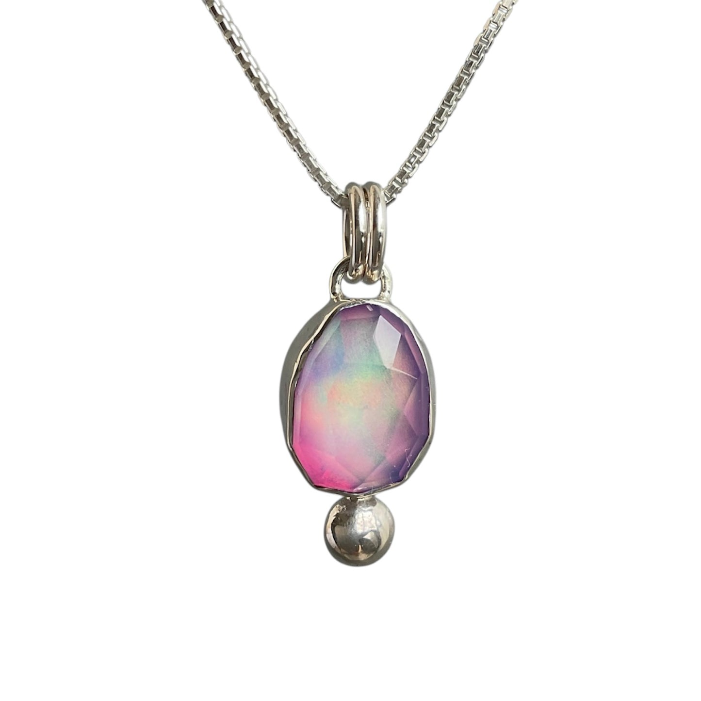 Necklace with a pendant featuring a colorful gemstone on a white background