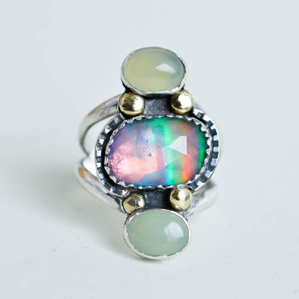 Flashy pink aurora opal gemstone paired with mint green jade oval stones and brass bead embellishments.