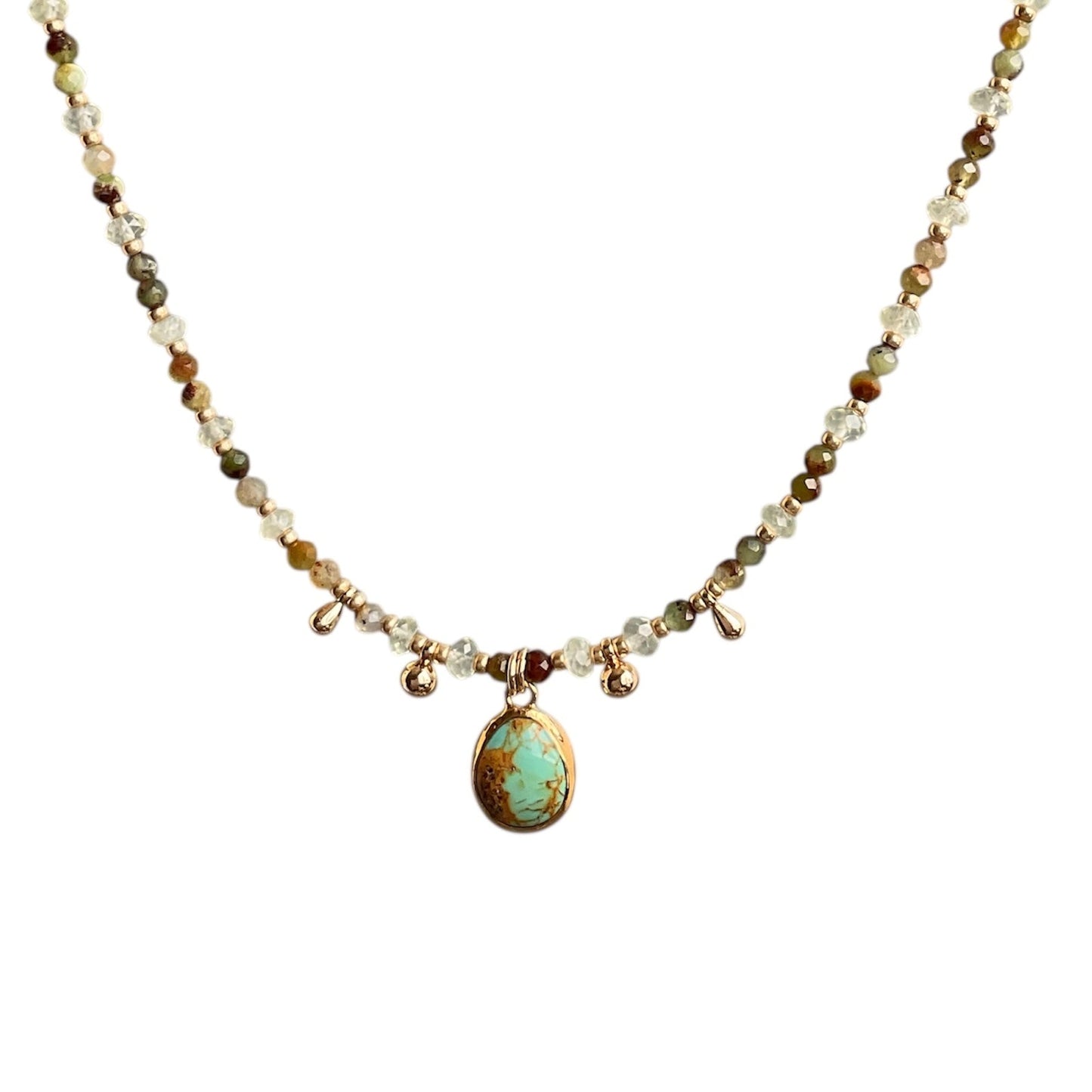Turquoise gemstone hanging from a beaded necklace with chrysoprase and prehnite gemstones
