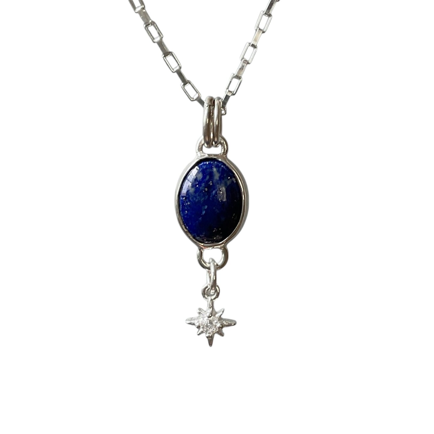 Necklace with a blue stone pendant and star charm on a white background