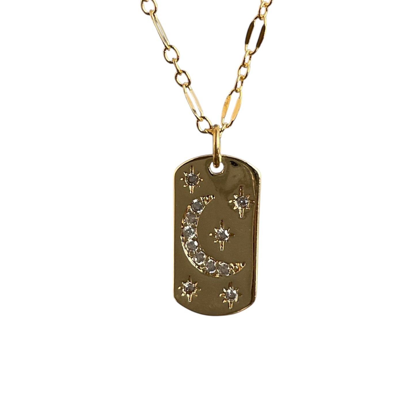Gold necklace with a dog tag pendant featuring a moon and star design on a white background