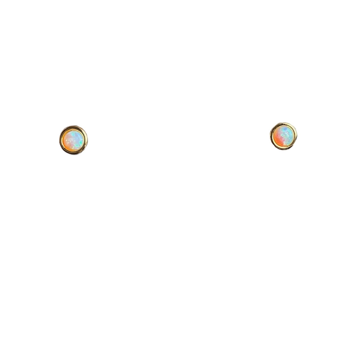 Tiny 3 millimeter opal stones in gold bezel settings on post earrings