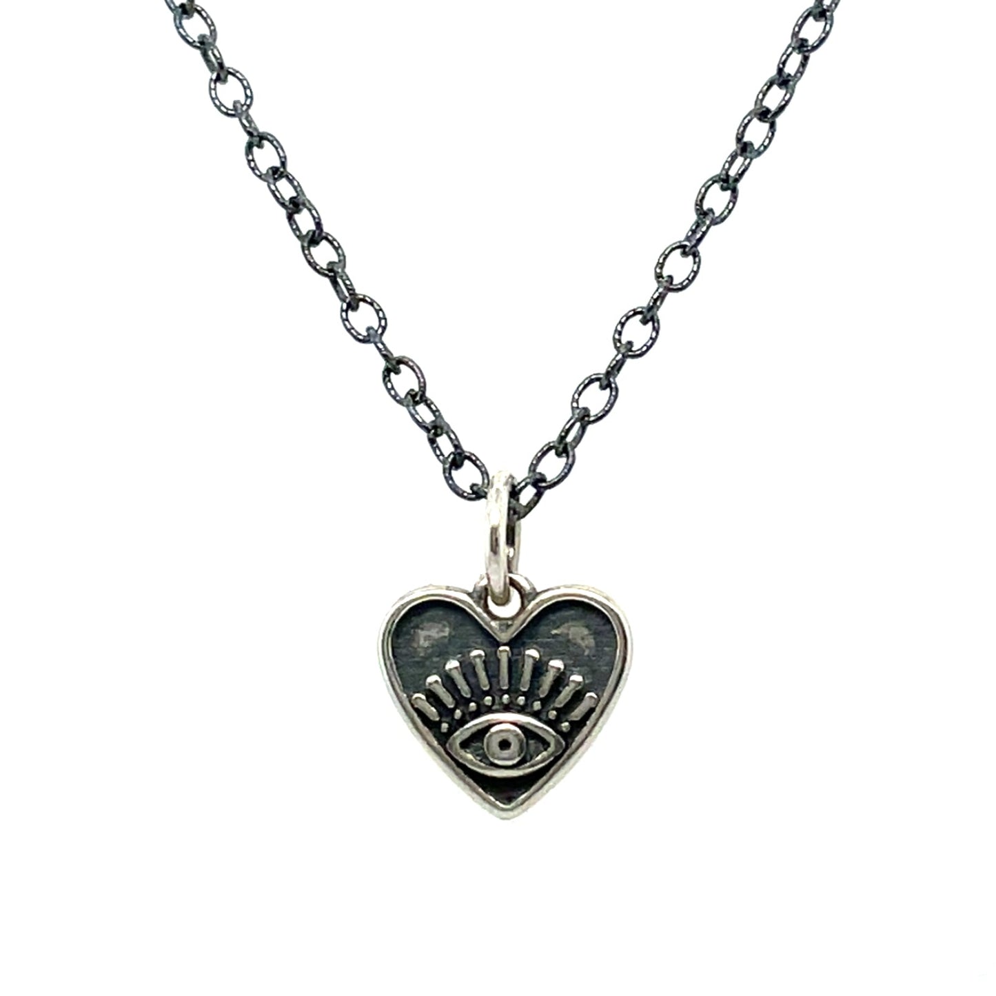 A necklace with an oxidized sterling silver chain and a heart-shaped pendant with an eye design in the center.