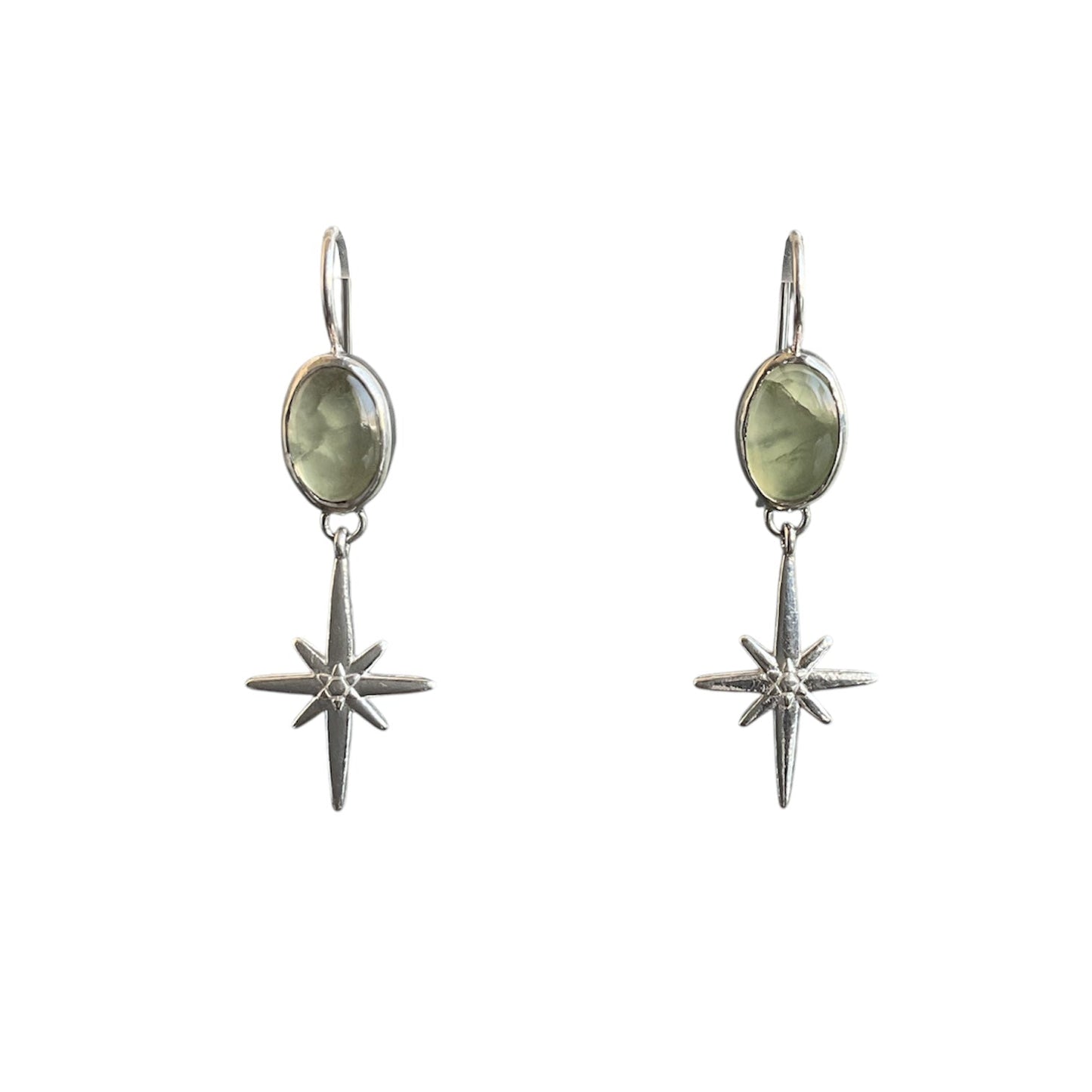 Shimmering silver north star post earrings connect to the dangle of a bezel-set, smooth, semitransparent phrenite gemstone.