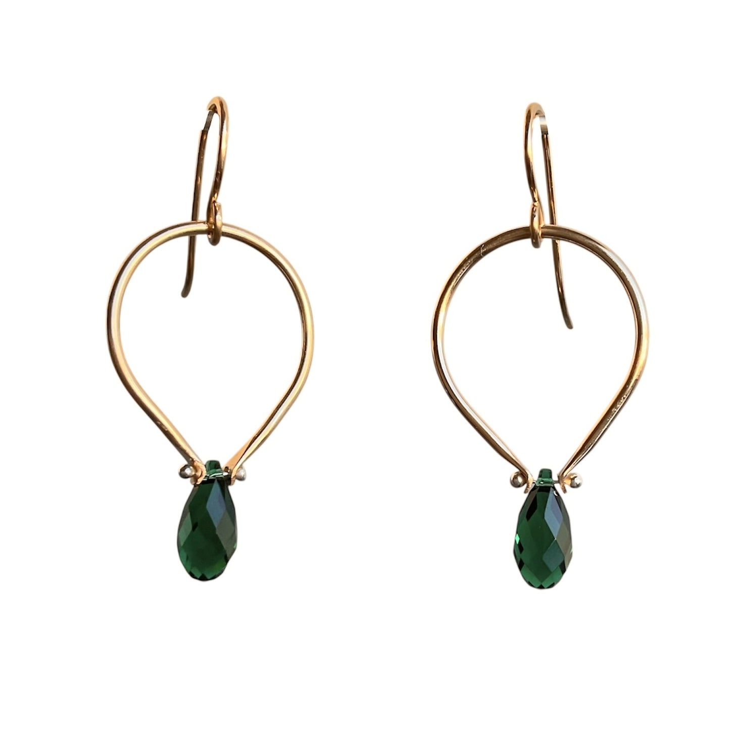 Gold hoop earrings with green teardrop beads on a white background