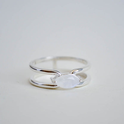 Double banded ring in shiny silver and 14k gold vermeil with a horizontal rainbow moonstone in a prong setting. 
