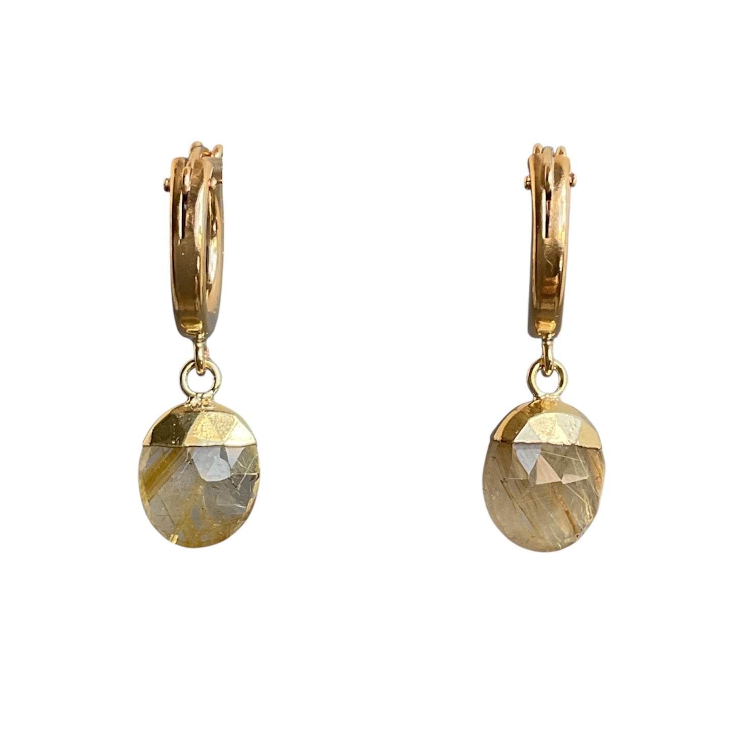 Gold hoop earrings with round faceted stones on a white background