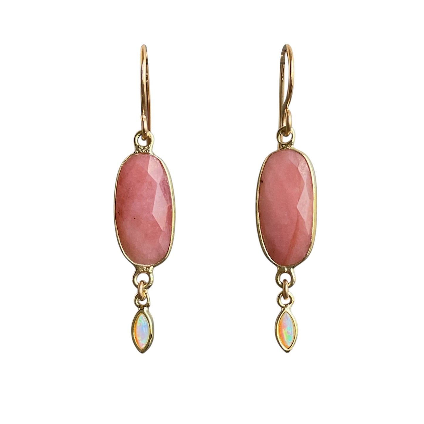 Pair of gold earrings with pink oval stones and smaller opal stones on a white background