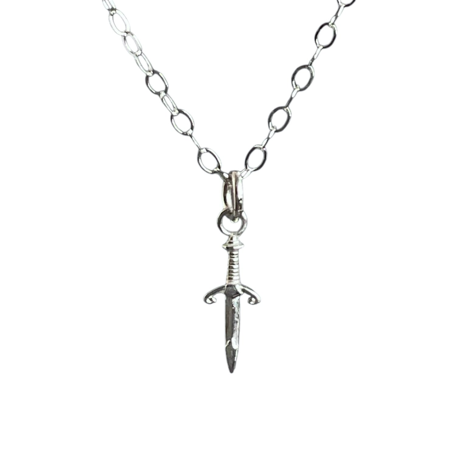 Silver sword pendant necklace on a white background