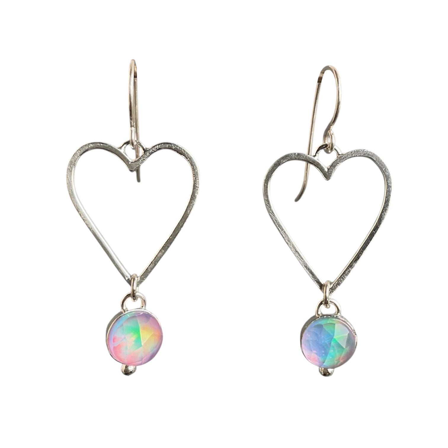 Heart-shaped earrings with colorful gemstones on a white background