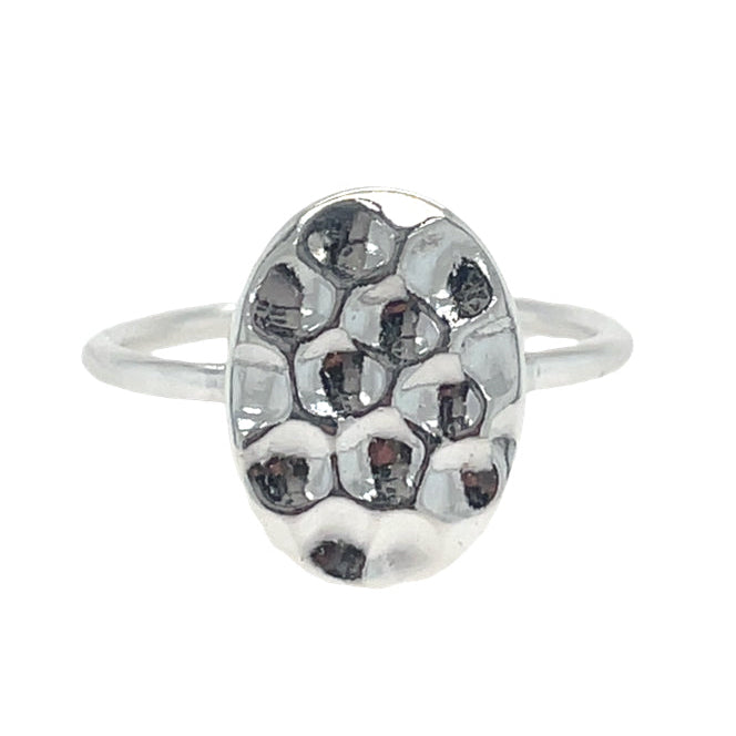 Silver ring with a textured oval design on a white background