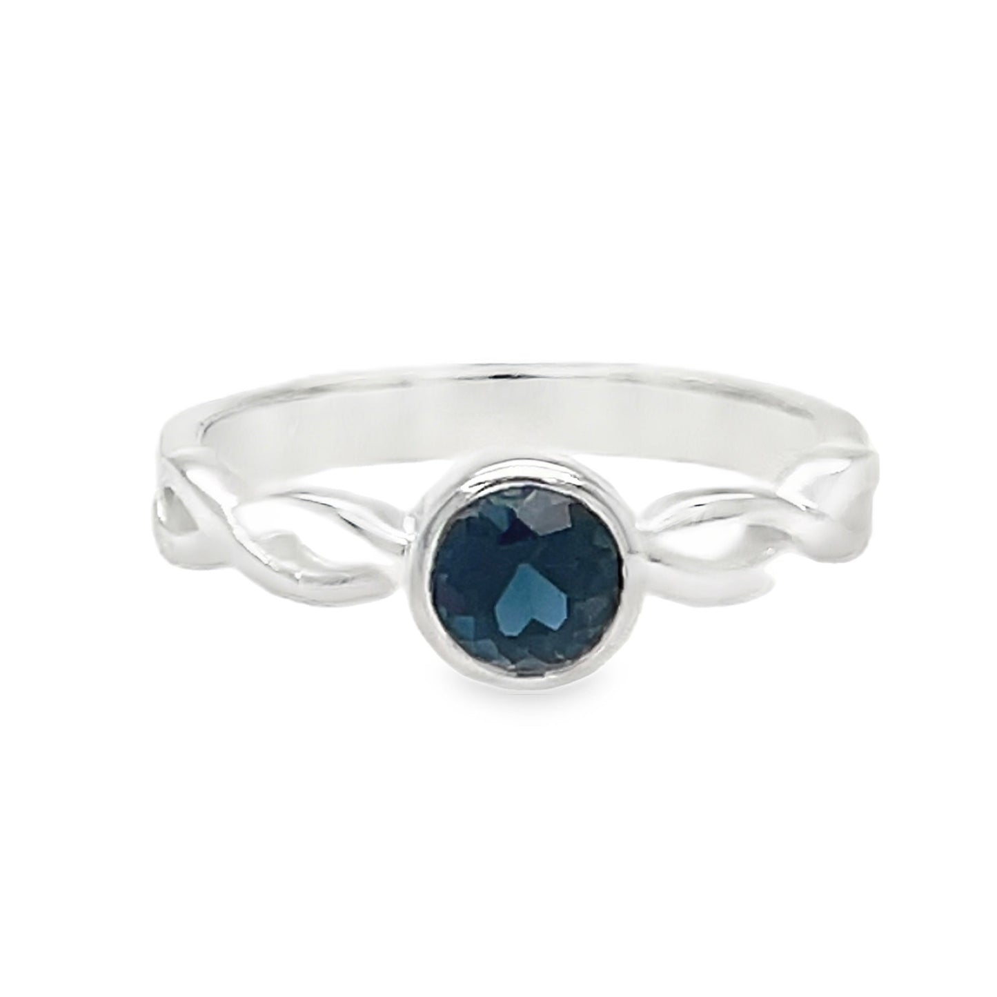 Silver ring with a blue gemstone on a white background