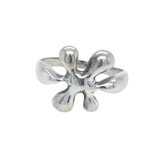 Silver four-petal flower ring on a white background