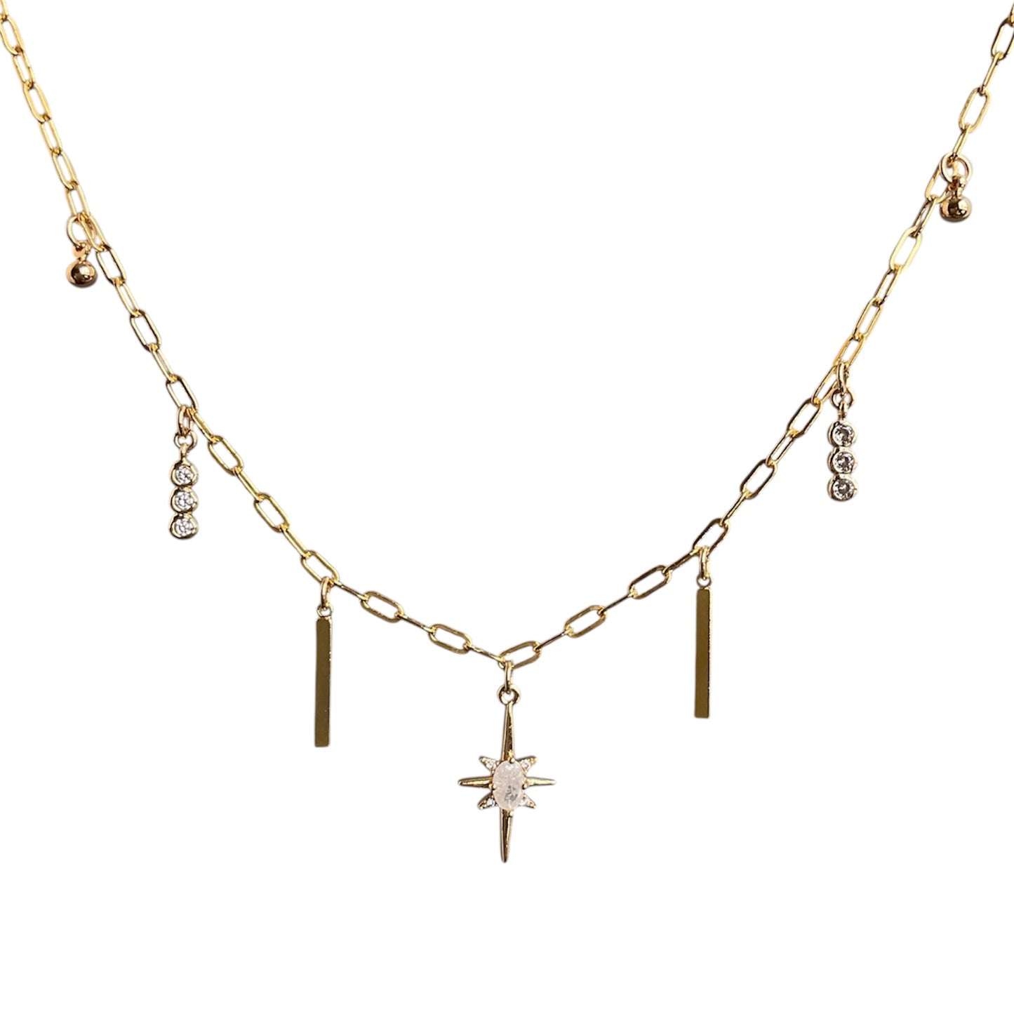 Gold necklace with star and bar pendants on a white background