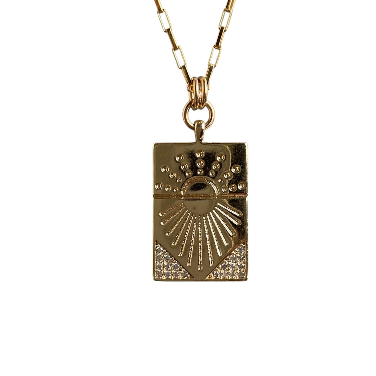 Gold pendant necklace with intricate design on a white background