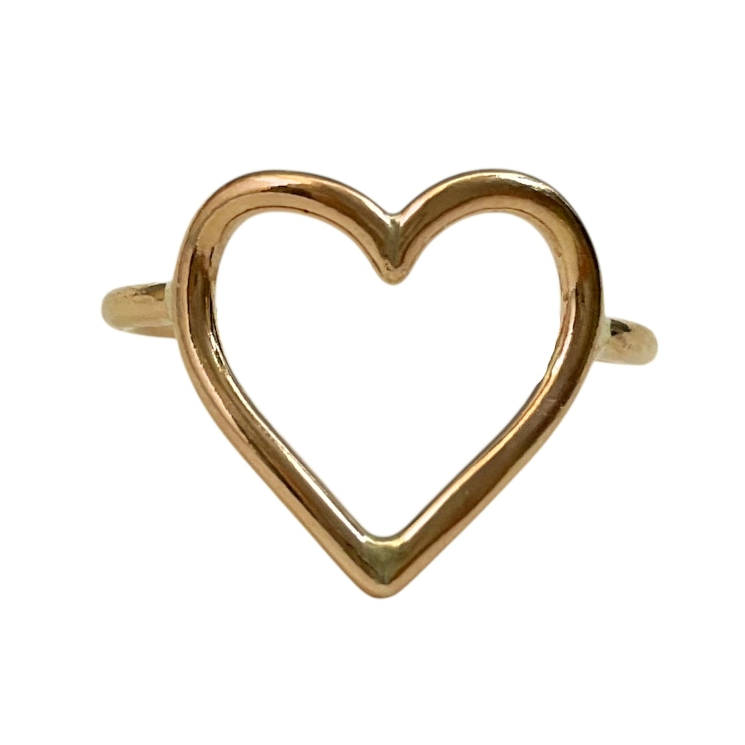 Gold heart-shaped ring on a white background