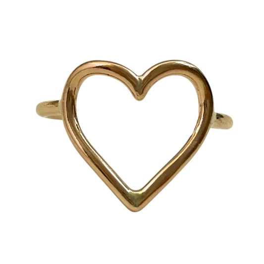 Gold heart-shaped ring on a white background
