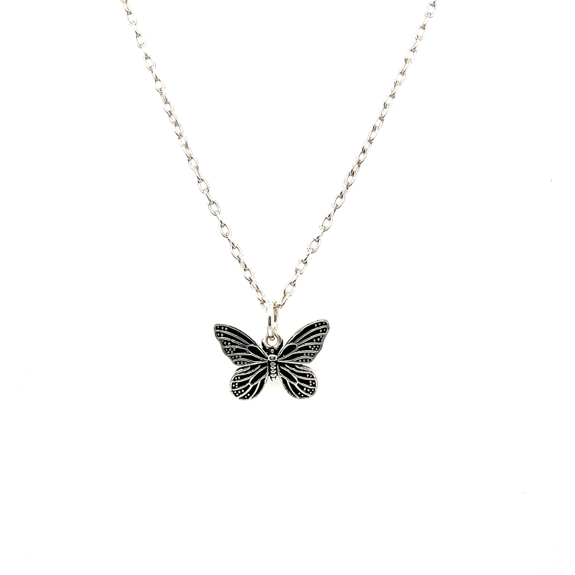 A sterling silver necklace with a butterfly pendant on a chain.