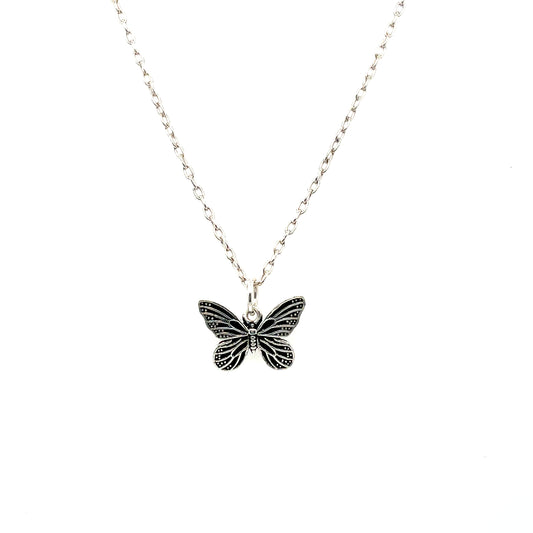 A sterling silver necklace with a butterfly pendant on a chain.