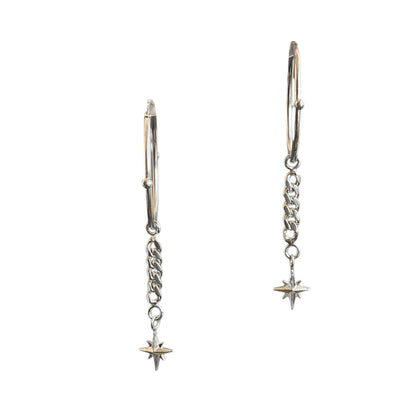 Hinged sterling silver hoops with a north star dangling at the end of a cuban link chain