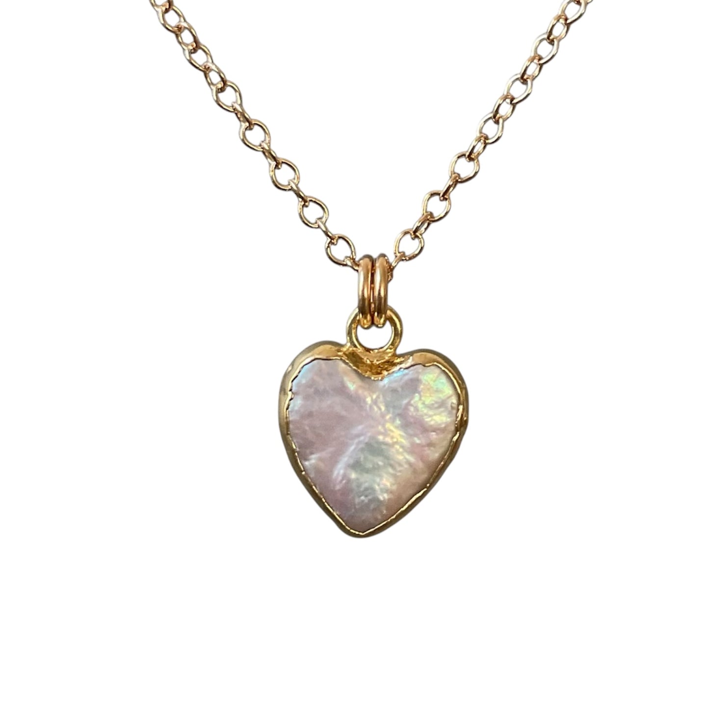 Gold necklace with a heart-shaped pearl pendant on a white background