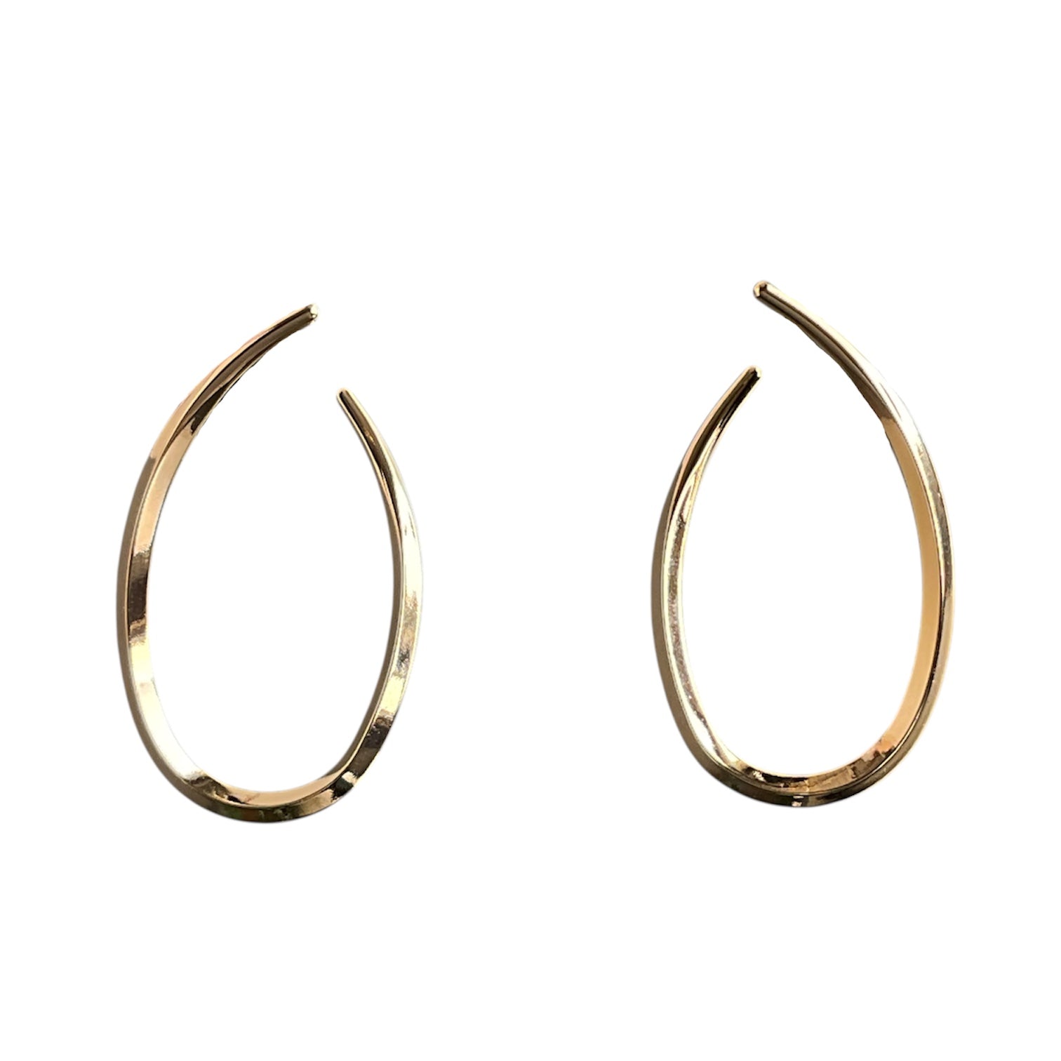 Medium-sized gold hoop earrings swoop follow a flat swoop from the front to the back of the earring.